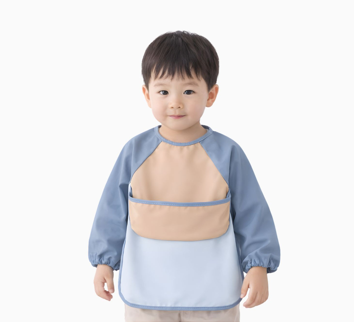 toddler boy wearing a blue and beige long sleeve bib