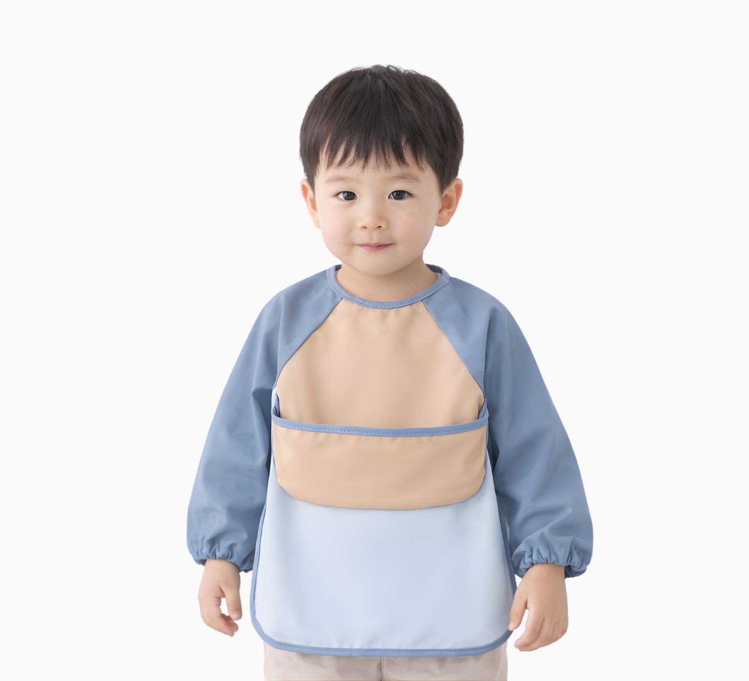 toddler boy wearing a blue and beige long sleeve bib