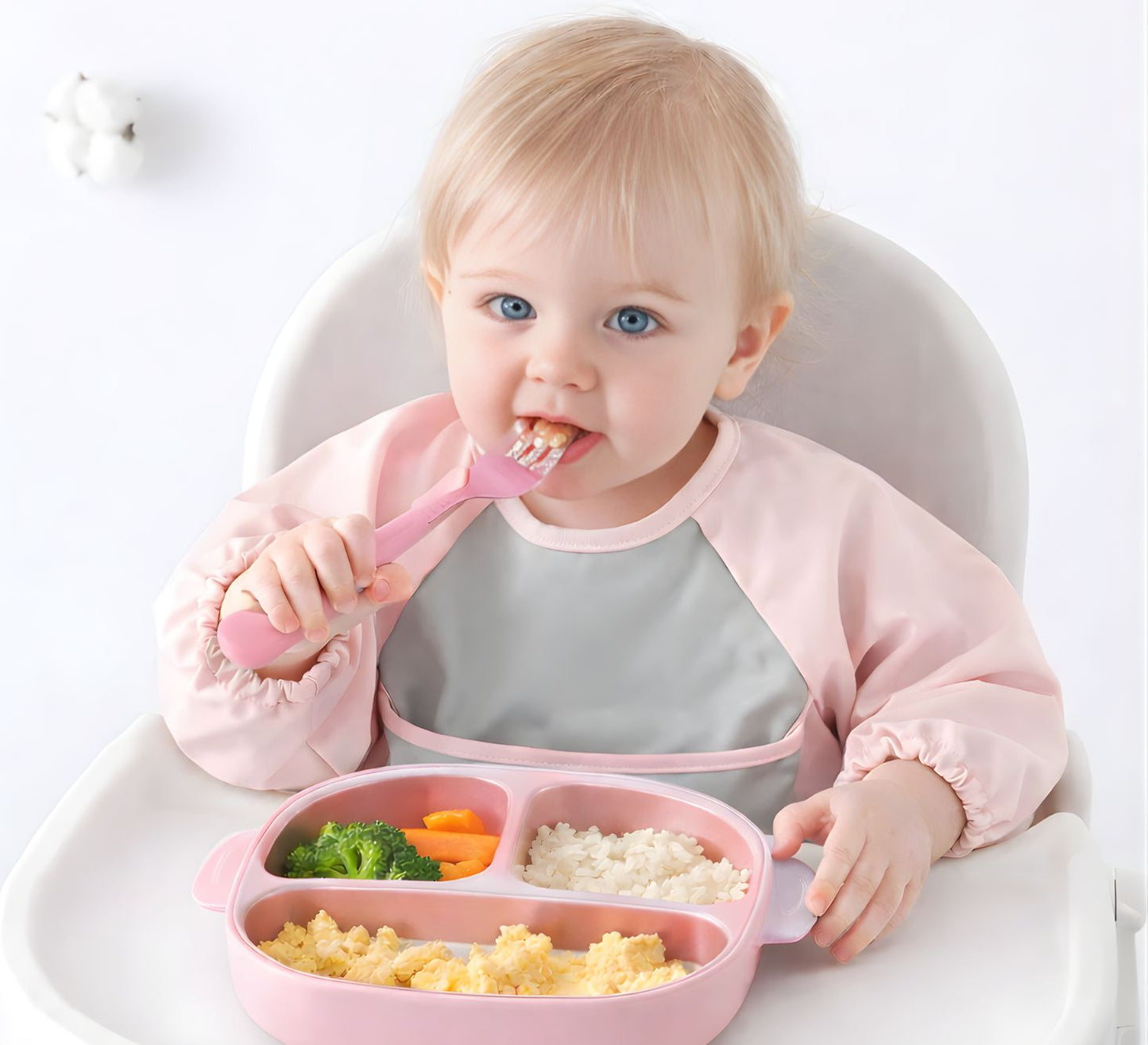 baby girl wearing waterproof pink bib